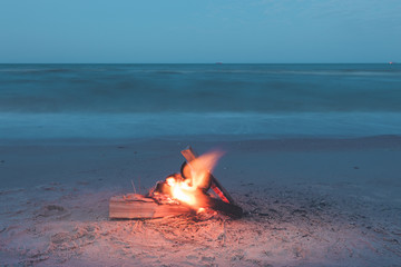 Inviting campfire on the beach during the summer, bring back fond memories