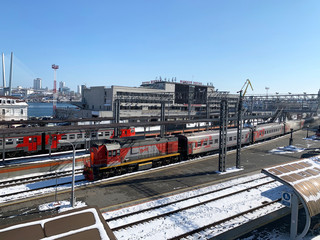 Vladivostok, Russia. Trains on the railway tracks at the station in the city of Vladivostok in early spring