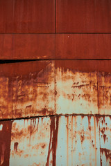 Old buildings covered with rust. Texture of old metal covered with rust background.
Metal agricultural silos.