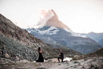 romantic epic engagement proposal in front of matterhorn in switzerland