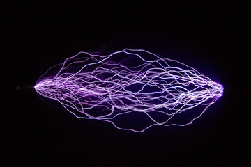 Image of trajectories of electric discharges for student projects. .Each discharge is made between...
