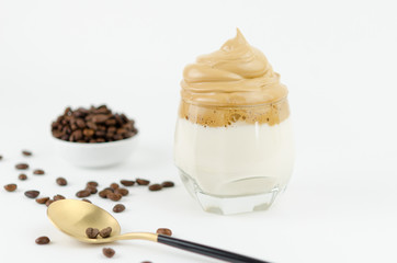 Dalgona frothy coffee trend Korean drink latte espresso with coffee foam on black background