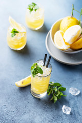 Fresh summer cocktail with lemons