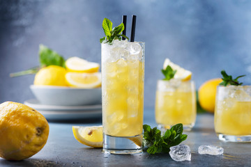 Fresh summer cocktail with lemons