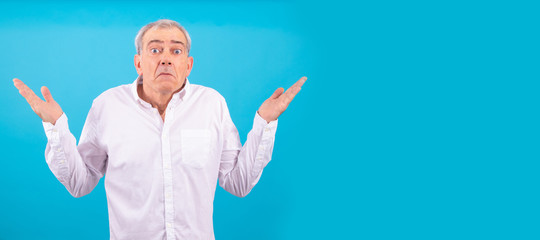 senior man with white shirt isolated on color background