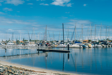Fototapeta na wymiar Yacht Club in Sunshine Coast Australia. Many boats on water at beautiful sunny day.