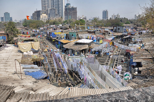 Mumbai, India-March 03,2013: Laundry Dhobi Ghat in Mumbai, people wash clothes on a city street. India's biggest wash.
