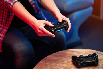 Gamer holding Gamepad, Controller or Videogame Joystick Console in hands. Close up, game concept