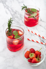 Summer strawberry drink on marble white background.