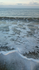 Wave of the sea on the sand beach