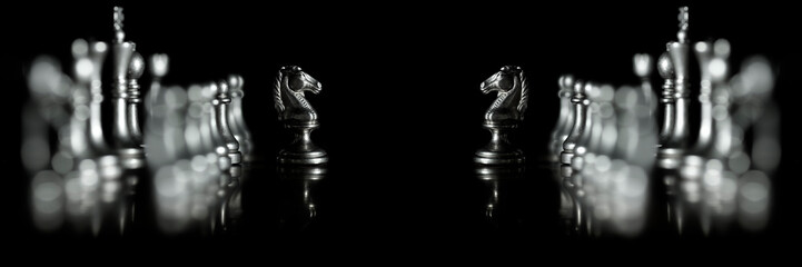 Pieces on chess board for playing game and strategy competition face off