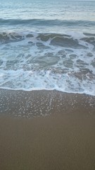 Wave of the sea on the sand beach