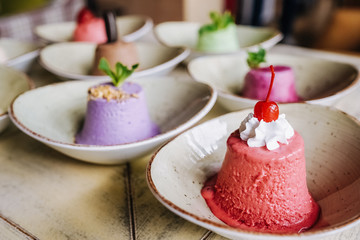 tasty handmade eco ice cream  in different colours served on a beautiful plate