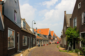 Pedestrian street with Dutch houses and large windows