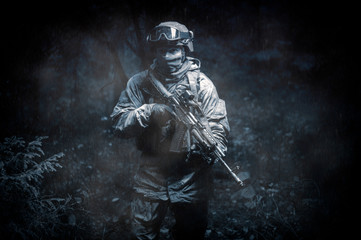 Portrait of a commando in the forest. The concept of military operations, international conflicts,...