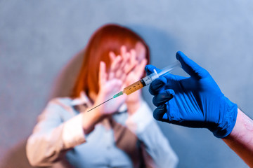 girl vaccine syringe injection fear