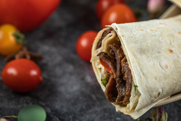 Meat shaurma rolls in lavash with tomatoes