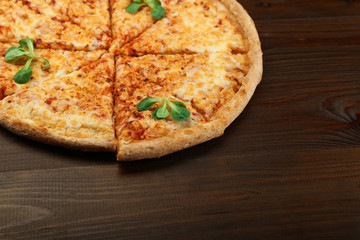 cheese pizza in rustic style top view with copy space on dark background