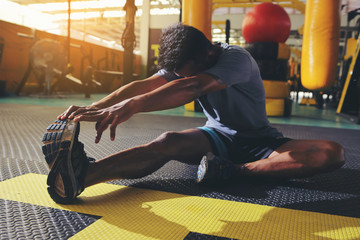 Athletes are stretching the muscles to prepare before exercise..