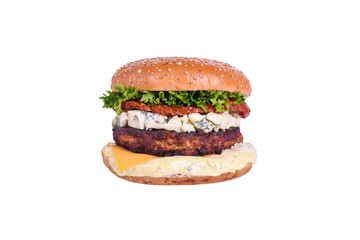 Fresh burger with chicken cutlet, dorblu cheese, sun-dried tomato, cheddar cheese, lettuce mix, dorblu sauce isolated on white background.