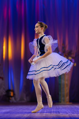 Young girls ballerina in a blue and white costume dancing performance on stage in a theater © Kozlik_mozlik