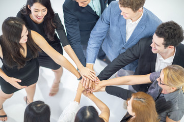 business team  join hands showing unity and teamwork