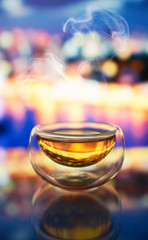 cup of tea against the background of the night city