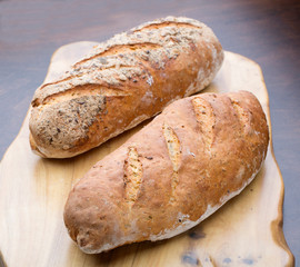 Two pieces of bread on a board