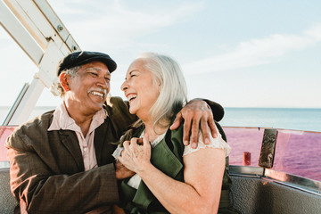 Happy senior couple on a Ferris wheel