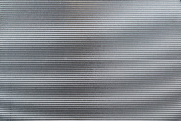 Close-up view of new condition of car radiator  texture background