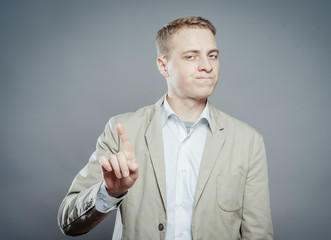 Portrait of making forefinger gesture man