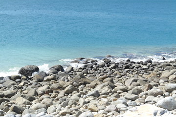 Fototapeta na wymiar beautiful Pebble beach, gray stones, blue sea. background