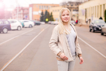 Happy blonde girl posing for the camera. Blondes Day Concept