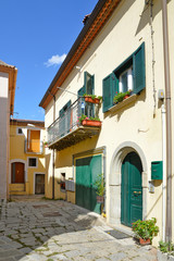 Fototapeta na wymiar A narrow street among the picturesque houses of a mountain village