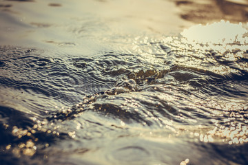 Water close-up in the sun. Whirlpool. Background.