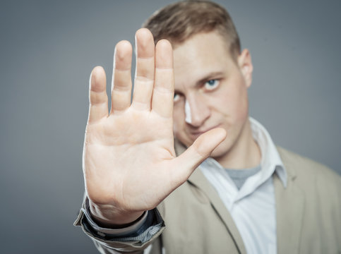 Business Man Holding Out Hand Stop