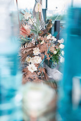 the wedding ceremony is decorated with flower arrangements and candle stands in a country complex restaurant