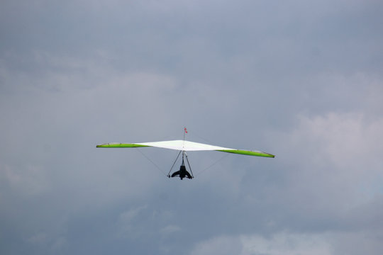 Hang glider in a cloudy sky