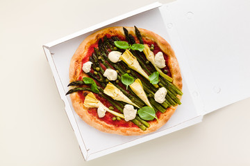 Vegan pizza asparagus in a box for delivery, advertising or menu