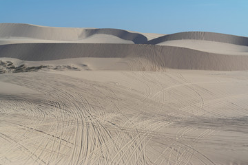 The White Sand Dunes of Mui Ne. Desert with traces of ATVs