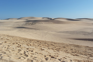 The White Sand Dunes of Mui Ne. Desert with traces of ATVs