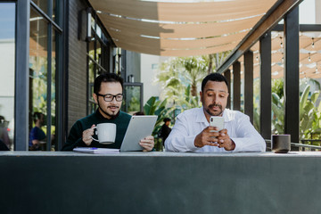 Men working in a coffee shop