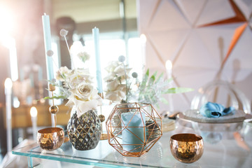 banquet table is decorated with plates, cutlery, glasses, candles and flower arrangements