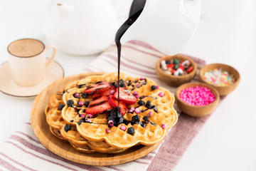 served with fruit and chocolate waffles