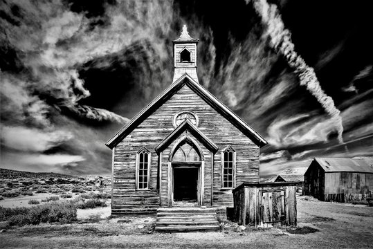 Grayscale shot of an old abandoned church at Bodie State Historic Park in California