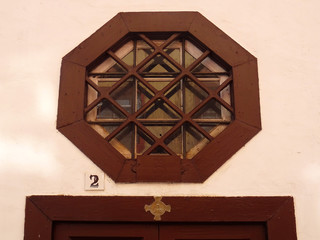 Hexagonal window in historic colonial building. Old city center of Santa Cruz. La Palma Island. Canary Islands. Spain. 