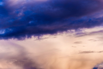Multi-colored thundercloud at sunset. Beautiful sky