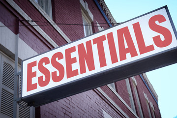 essentials sign on old building