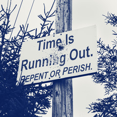 Religious repent or perish sign on telephone pole