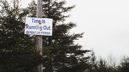 Religious repent or perish sign on telephone pole